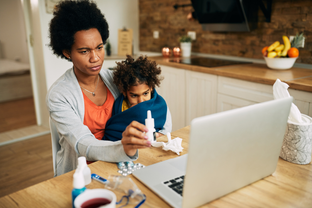 Mother & child in telemedicine consultation